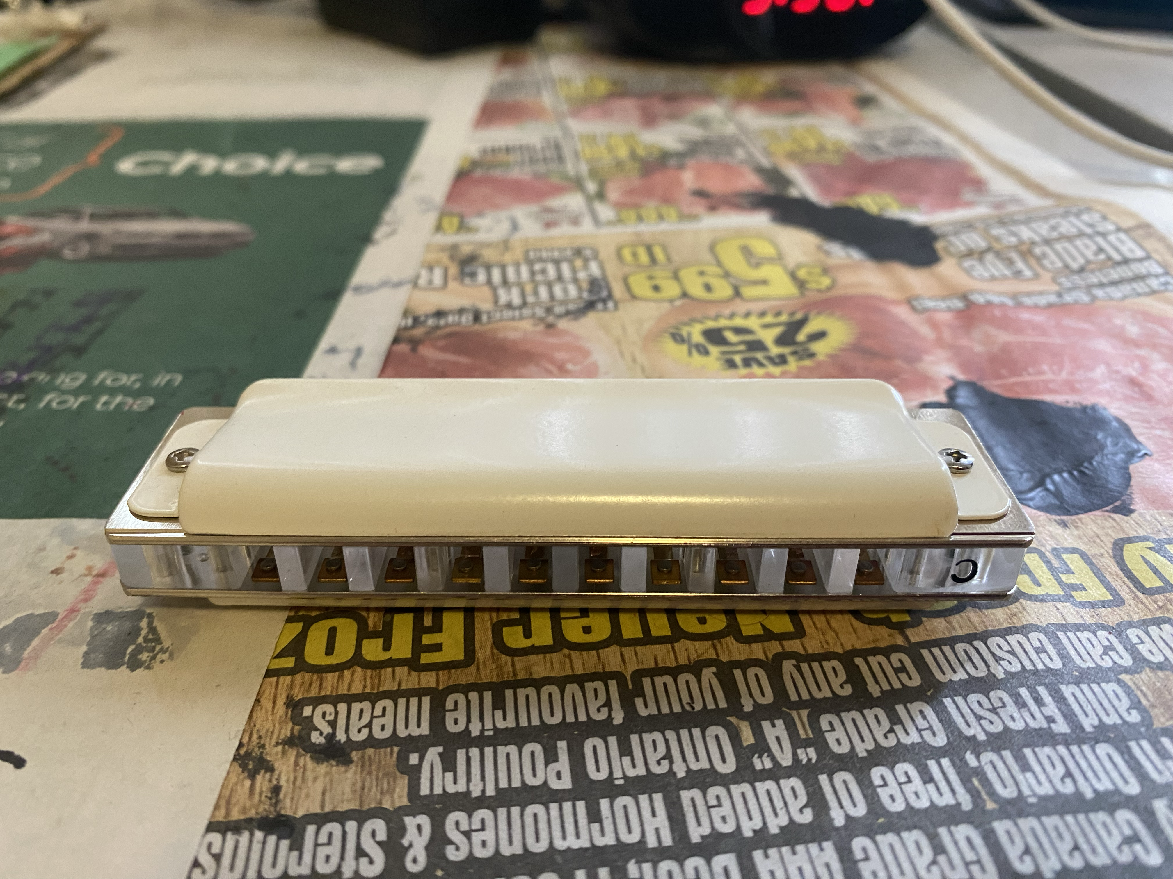 A photo of a Harmonica sitting on a table.